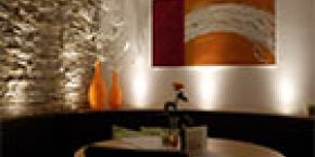 Karpfen am Illmensee - Aktuelles - Restaurant - gemütlicher Ecktisch mit Wandbild